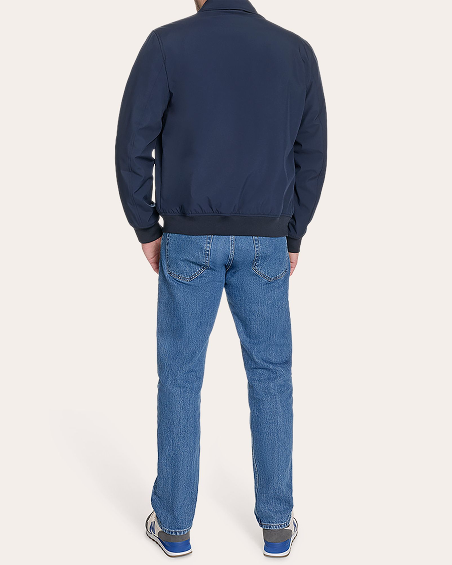 Back view of model wearing Navy Blazer Go Golf Bomber.