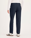 Back view of model wearing Navy Blazer Go Pant, Slim Fit with Airweave.
