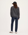 Back view of model wearing Navy Blazer Go Pant, Slim Fit with Airweave.