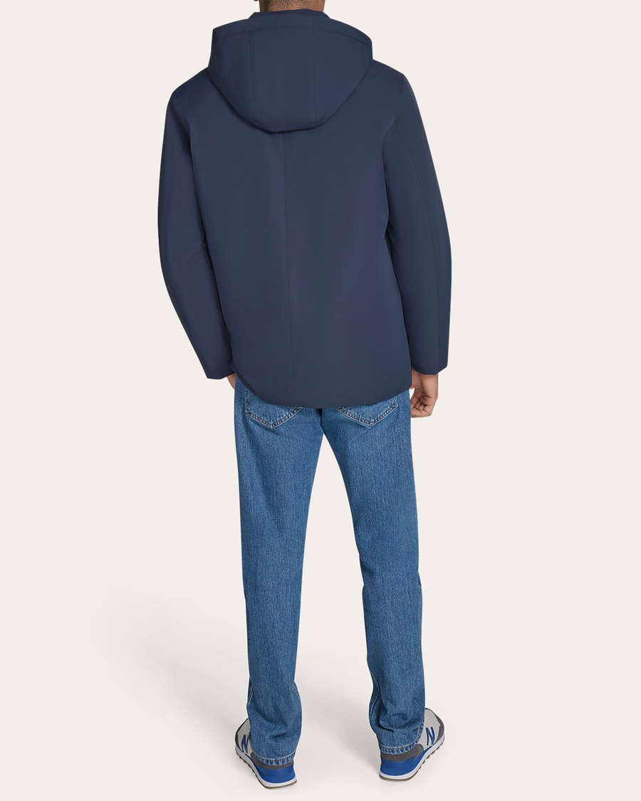 Back view of model wearing Navy Blazer Go Rain Commuter Jacket.