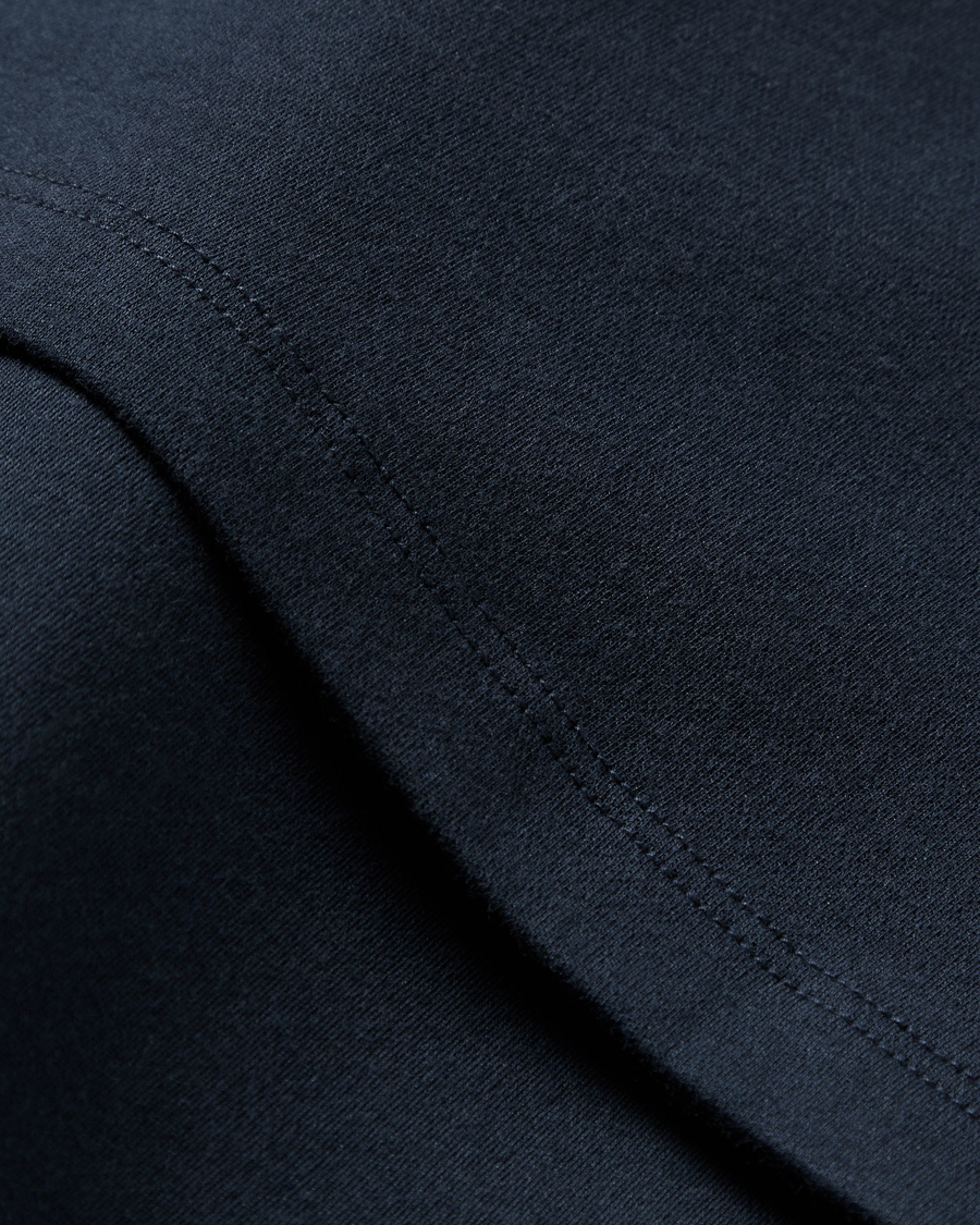 View of model wearing Navy Blazer Go Tee, Slim Fit.