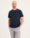 Front view of model wearing Navy Blazer Go Tee, Slim Fit.