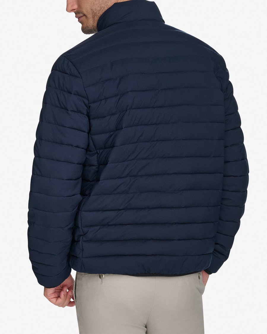 Back view of model wearing Navy Blazer Men's Packable Jacket.