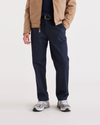 Front view of model wearing Navy Blazer Men's Relaxed Tapered Fit Original Chino Pants.