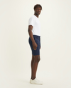 Side view of model wearing Navy Blazer Men's Supreme Flex Modern Chino Short.