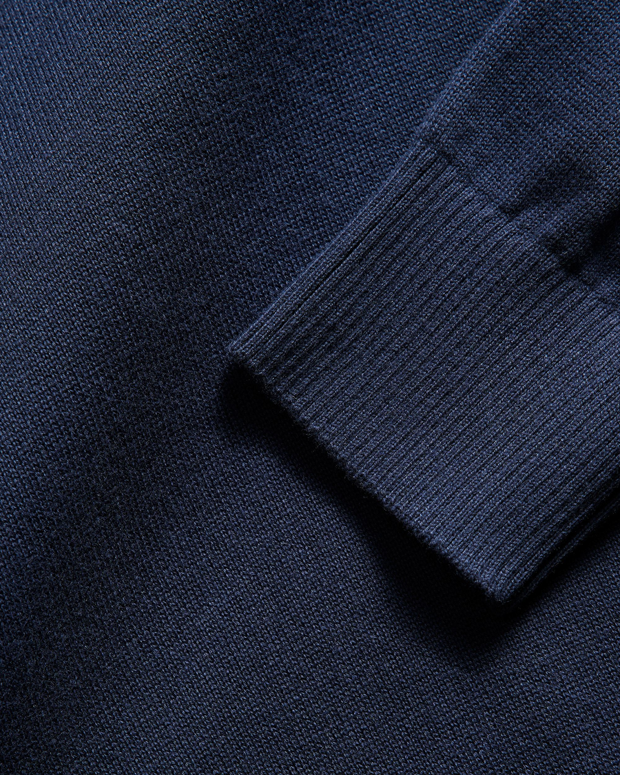 View of model wearing Navy Blazer V Neck Sweater.