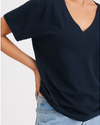 View of model wearing Navy Blazer Women's Deep V-Neck Tee Shirt.