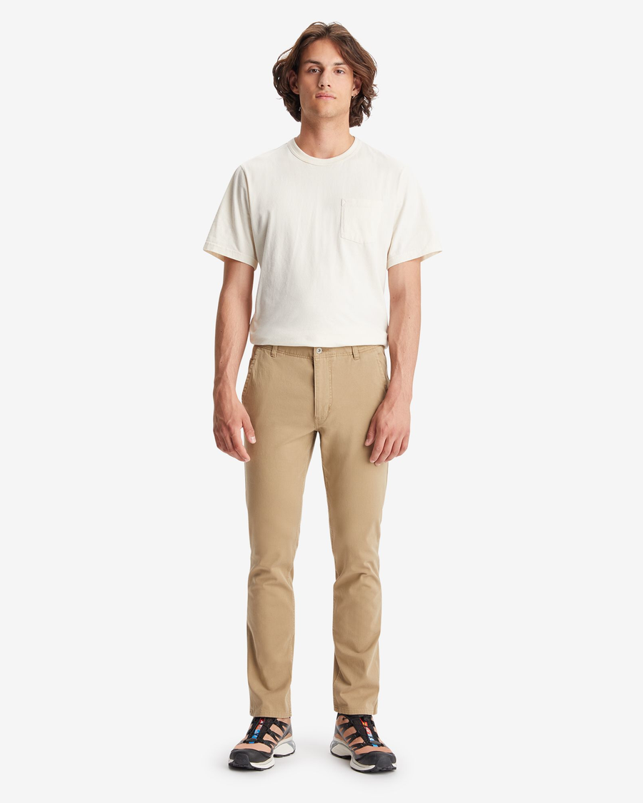 Front view of model wearing New British Khaki Men's Skinny Fit Smart 360 Flex Alpha Khaki Pants.