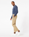 Side view of model wearing New British Khaki Men's Slim Fit Smart 360 Flex Ultimate Chino Pants.