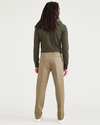 Back view of model wearing New British Khaki Signature Iron Free Khakis, Creased, Slim Fit with Stain Defender®.