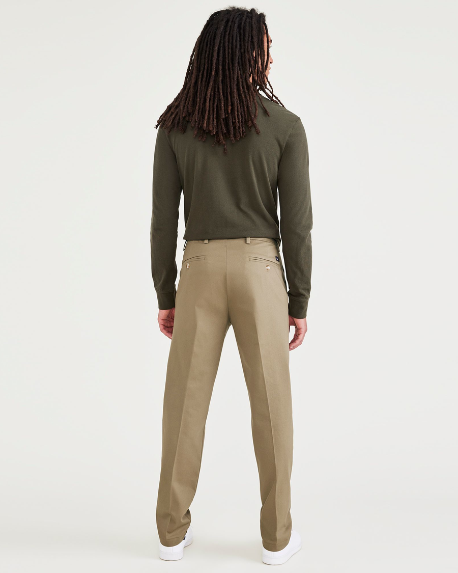 Back view of model wearing New British Khaki Signature Iron Free Khakis, Creased, Slim Fit with Stain Defender®.