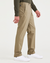 Side view of model wearing New British Khaki Signature Iron Free Khakis, Creased, Slim Fit with Stain Defender®.