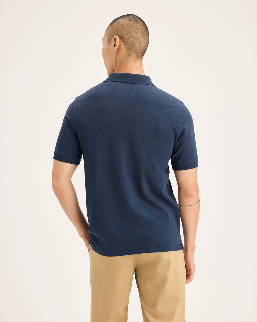 Back view of model wearing Ocean Blue Men's Slim Fit Pique Polo.