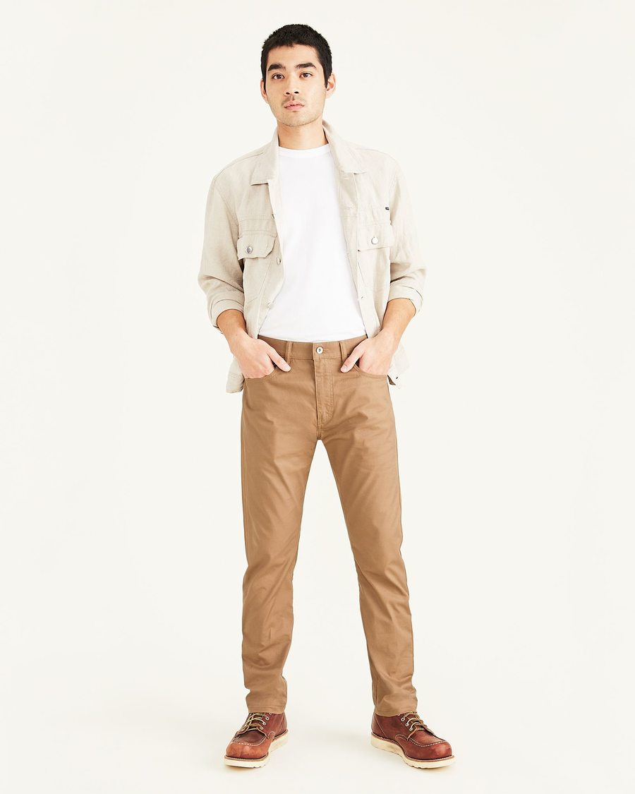 Front view of model wearing Otter Men's Slim Fit Smart 360 Flex Jean Cut Pants.