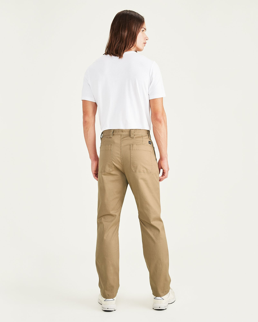 Back view of model wearing Otter Men's Straight Fit Utility Pants.