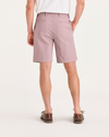 Back view of model wearing Pale Mauve Alpha 8" Shorts.