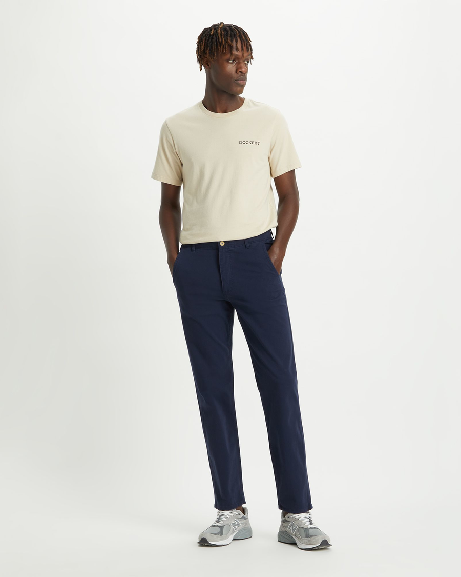 Front view of model wearing Pembroke Men's Slim Fit Smart 360 Flex Alpha Khaki Pants.