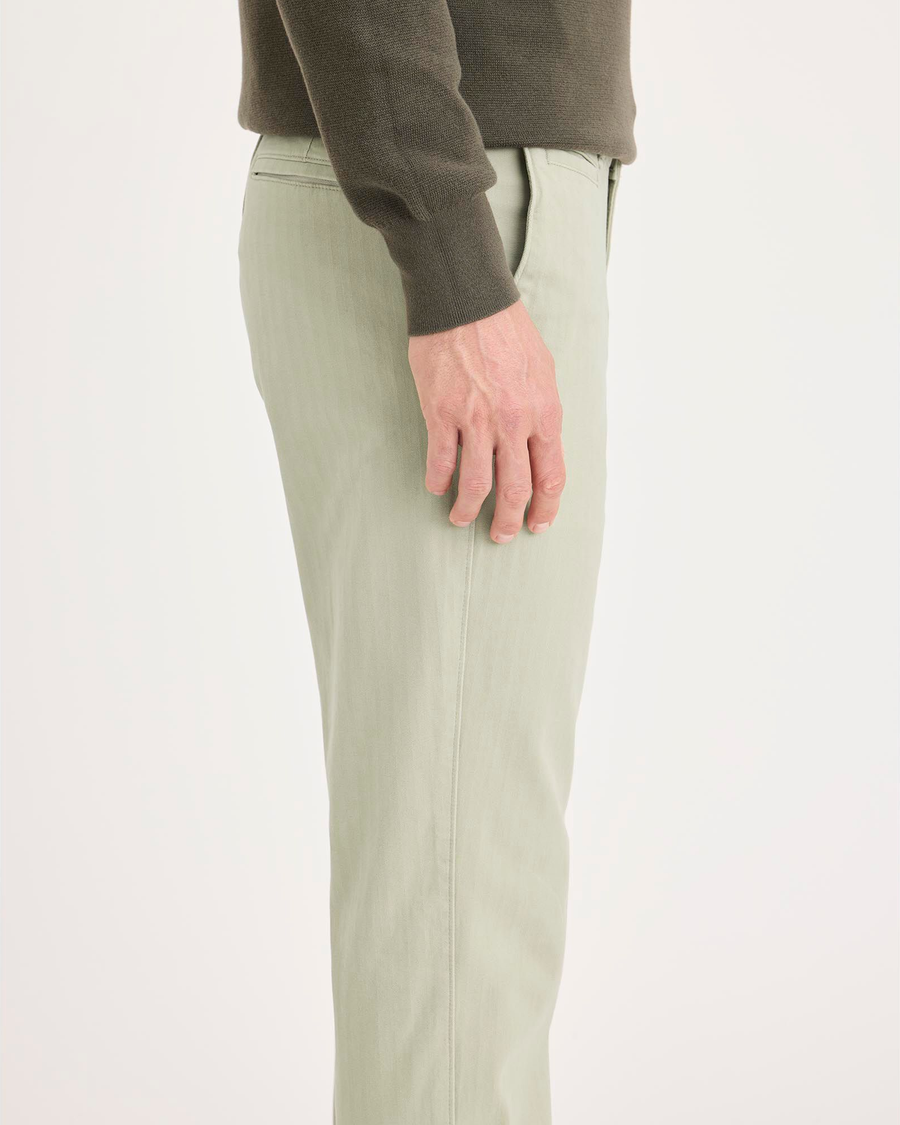 Side view of model wearing Pure Cashmere Alpha Chino Pants, Slim Fit.
