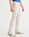 Side view of model wearing Sahara Khaki Alpha Chino Pants, Skinny Fit.