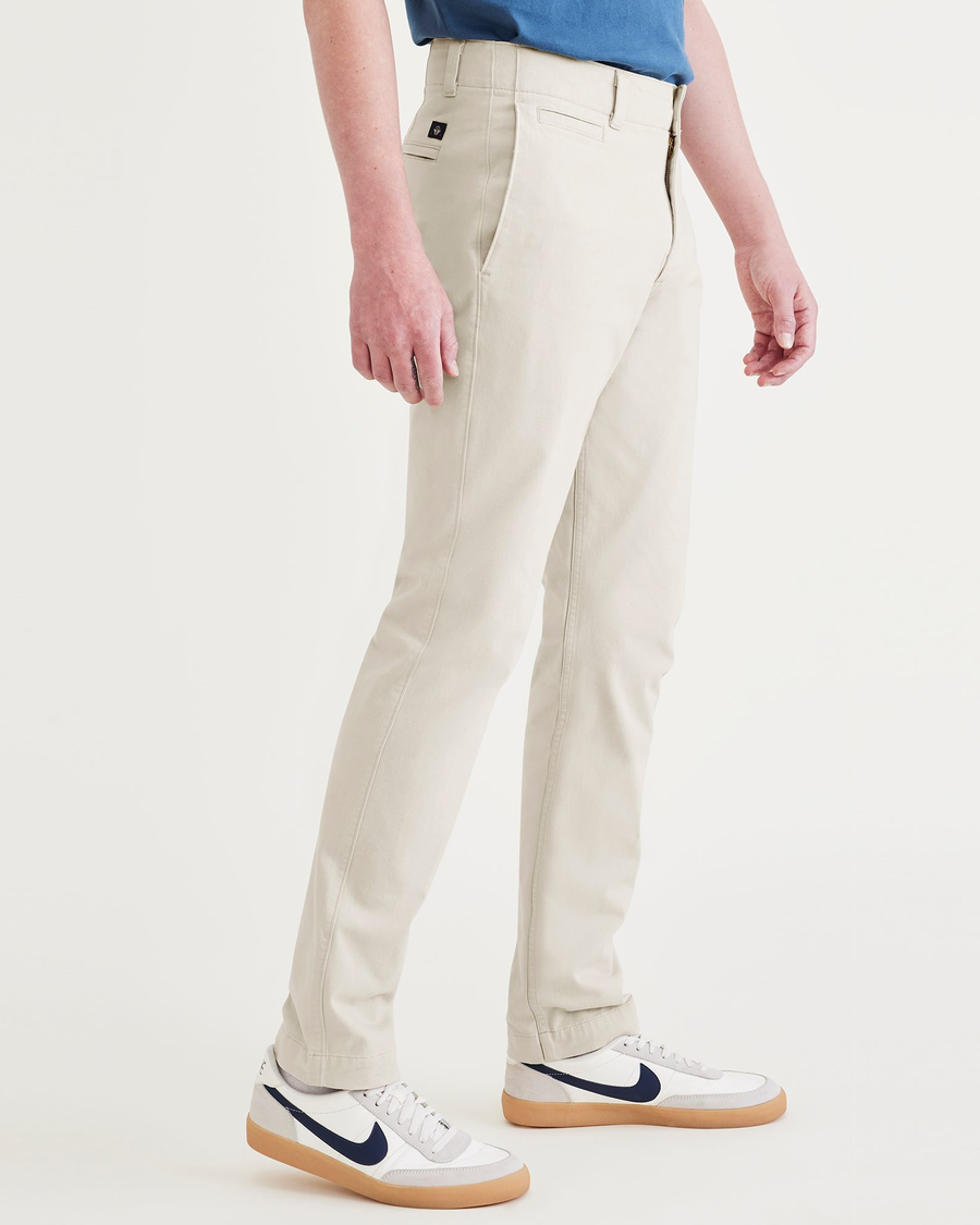 Side view of model wearing Sahara Khaki Men's Skinny Fit Smart 360 Flex California Chino Pants.