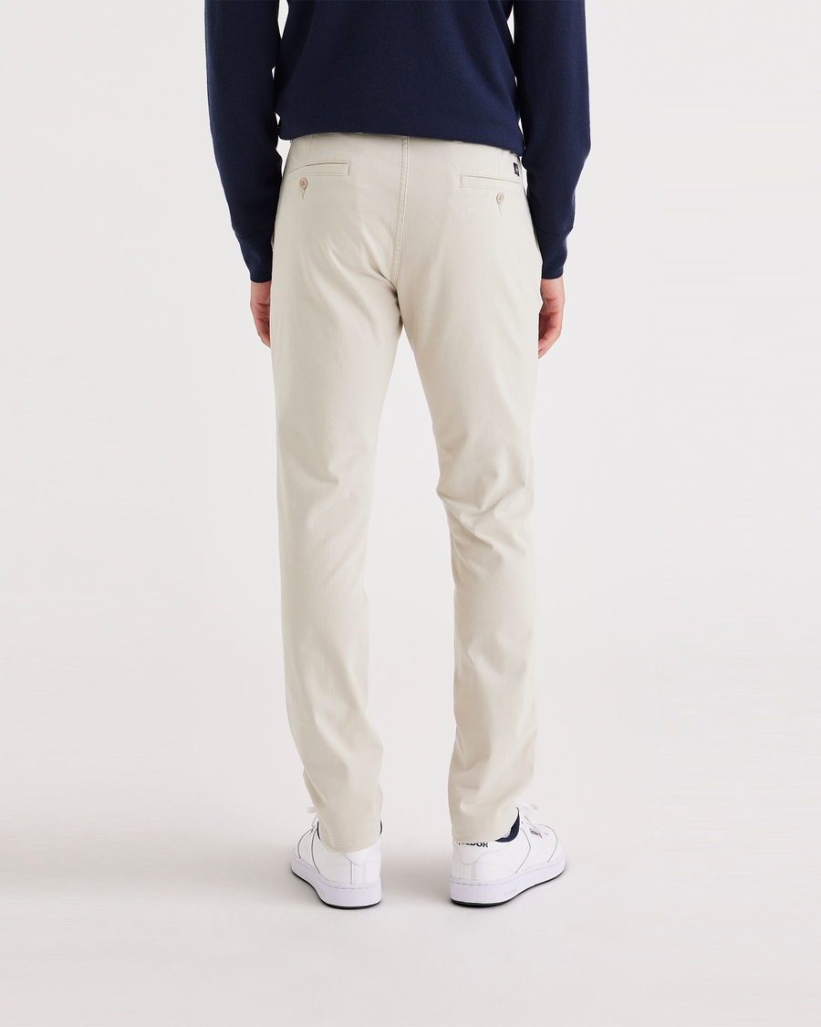 Back view of model wearing Sahara Khaki Men's Smart 360 Flex Ultimate Chino.