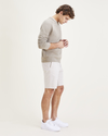 Side view of model wearing Sahara Khaki Men's Supreme Flex Modern Chino Short.