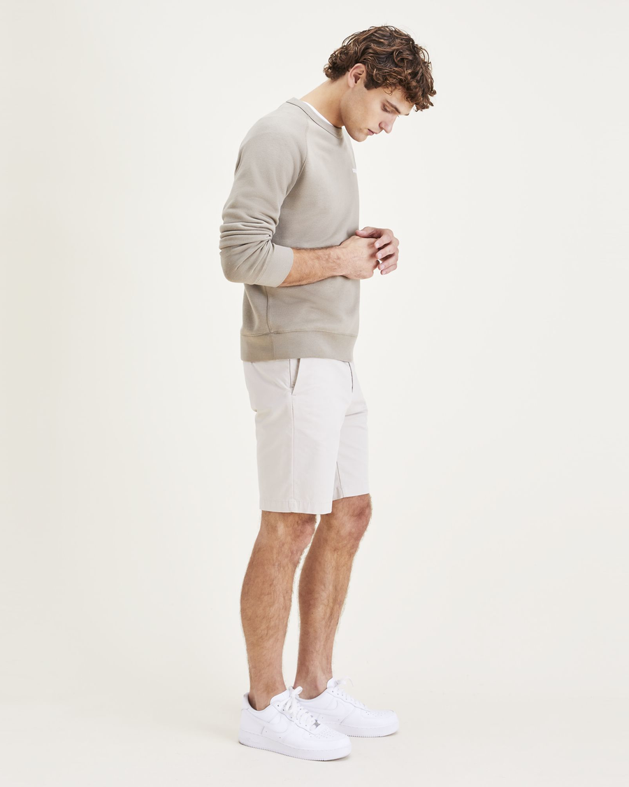 Side view of model wearing Sahara Khaki Men's Supreme Flex Modern Chino Short.