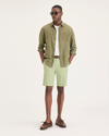 Front view of model wearing Seedling Men's Supreme Flex Modern Chino Short.