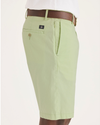 Side view of model wearing Seedling Men's Supreme Flex Modern Chino Short.