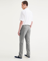 Back view of model wearing Sharkskin Alpha Chino Pants, Slim Fit.