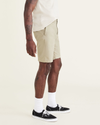 Side view of model wearing Silver Sage Men's Supreme Flex Modern Chino Short.