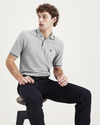 View of model wearing Smokestack Heather Men's Slim Fit Original Polo.