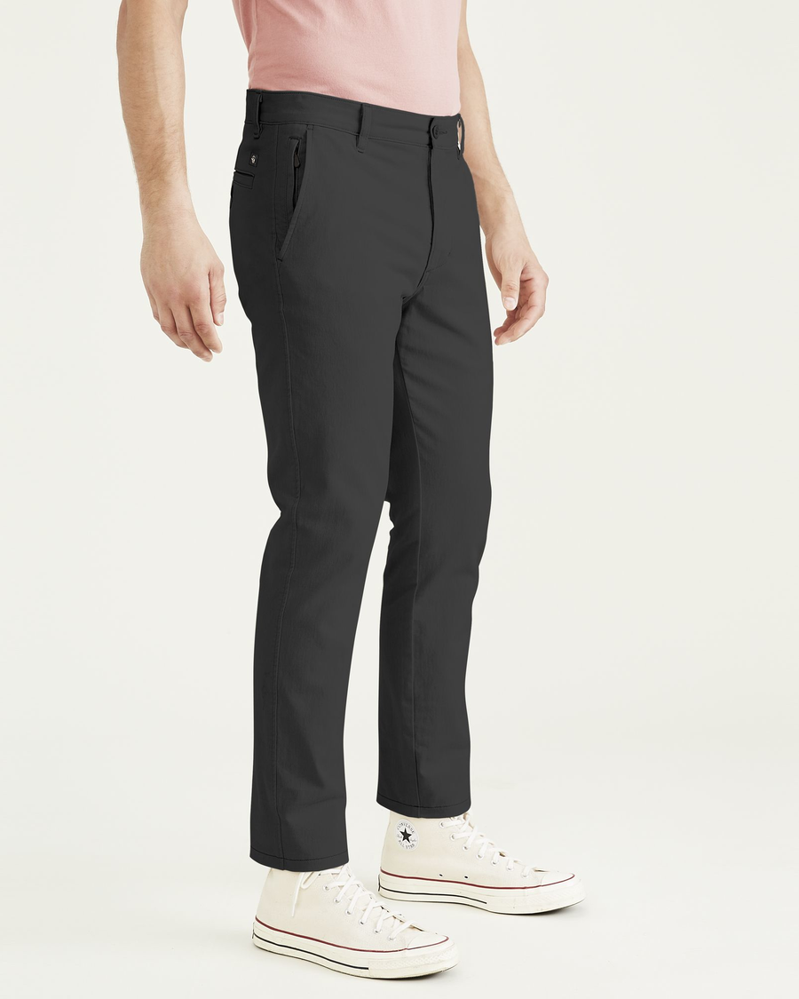 Side view of model wearing Steelhead Ultimate Chinos, Skinny Fit.