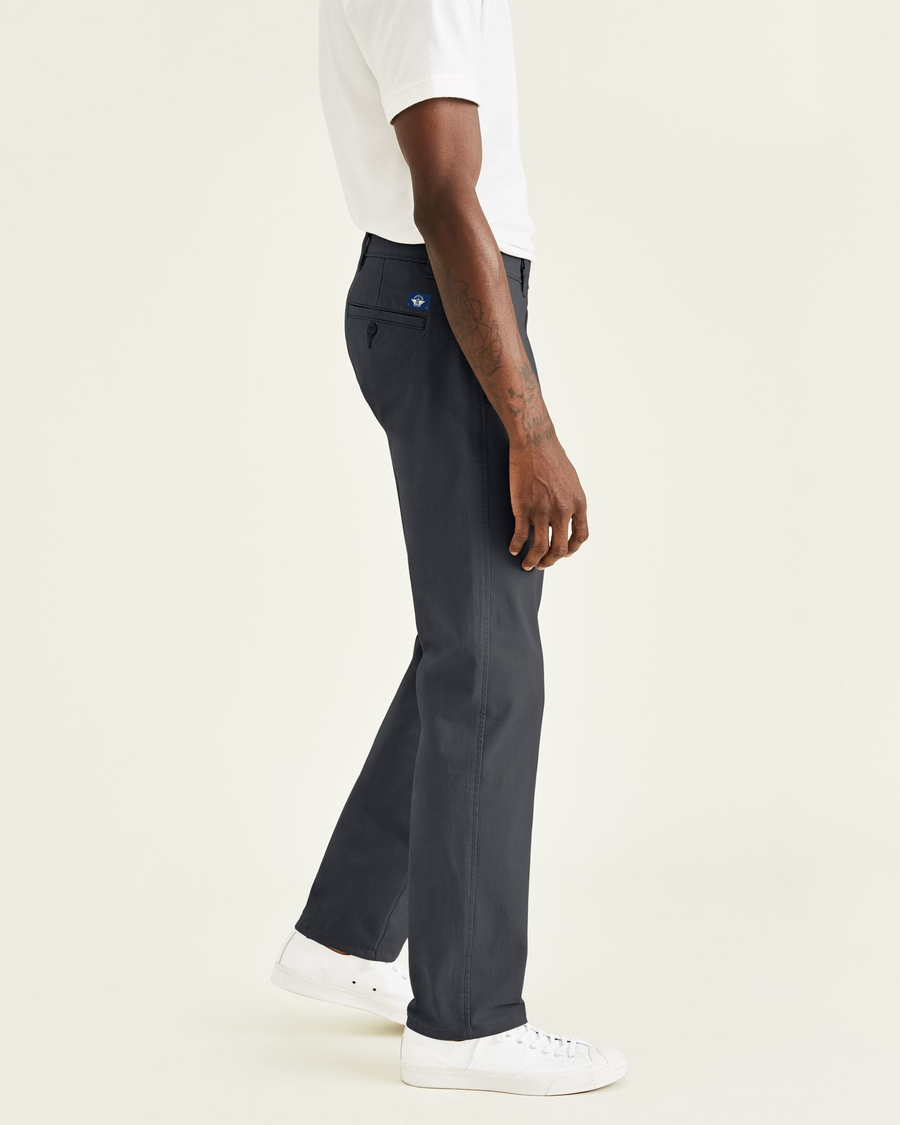 Side view of model wearing Steelhead Ultimate Chinos, Straight Fit.
