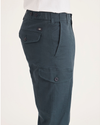 Side view of model wearing Stratified Sea Men's Slim Tapered Fit Cargo Pants.