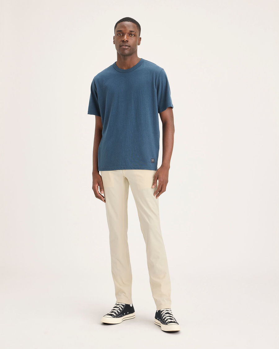 Front view of model wearing Summer Earth Men's Skinny Fit Smart 360 Flex California Chino Pants.