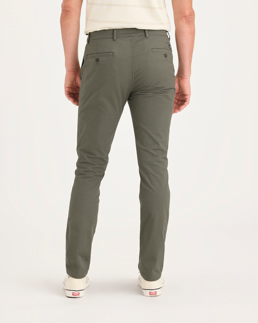 Back view of model wearing Tea Leaf Men's Skinny Fit Original Chino Pants.