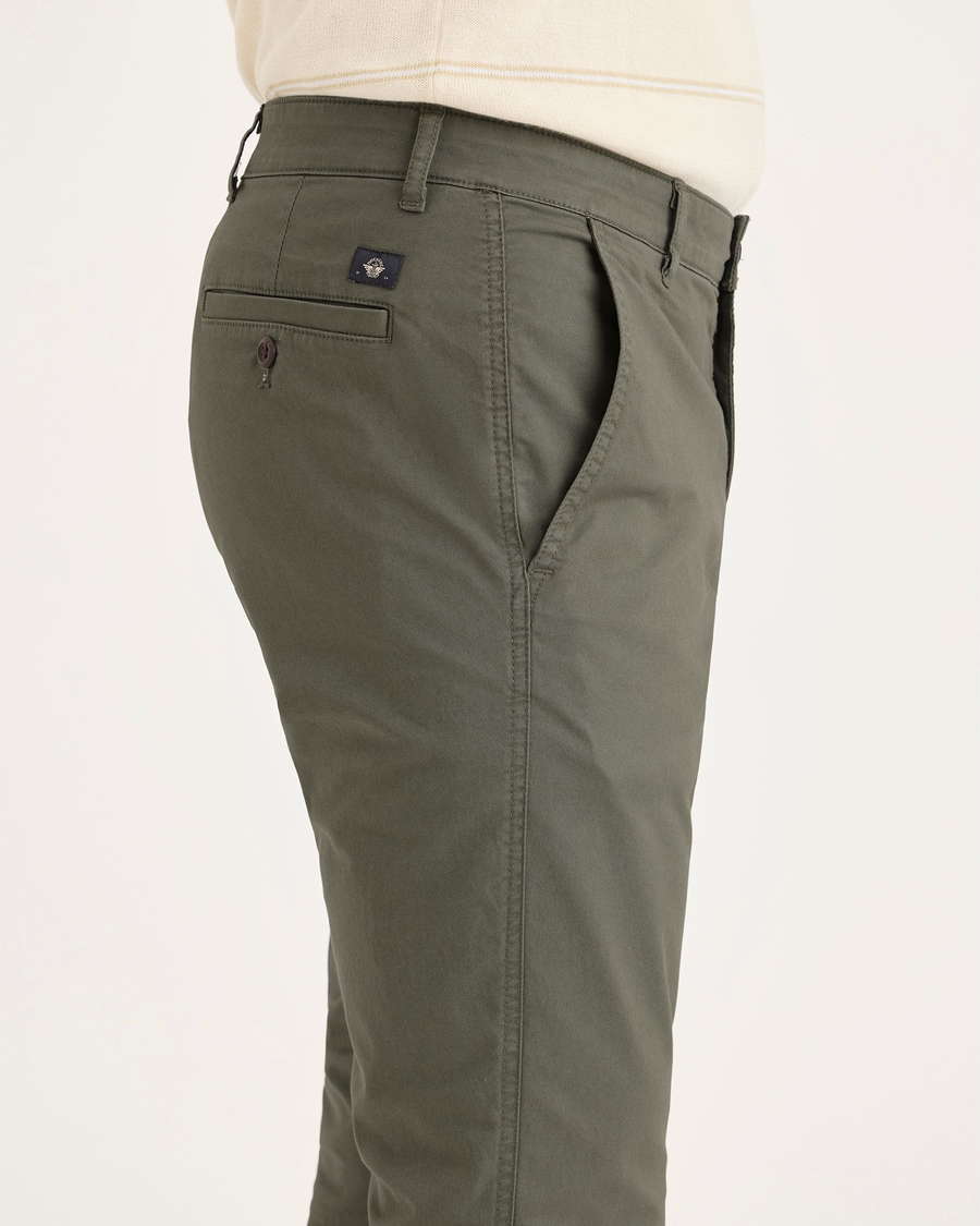 Side view of model wearing Tea Leaf Men's Skinny Fit Original Chino Pants.