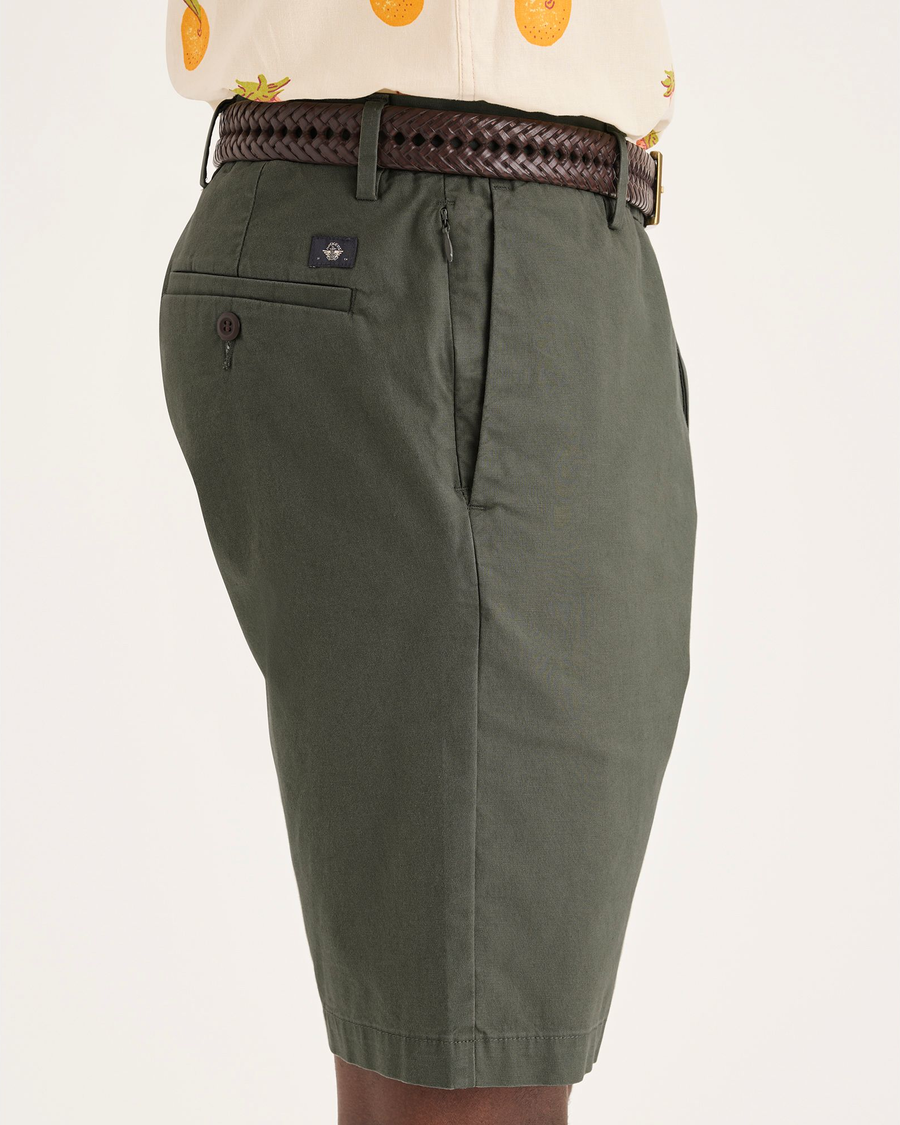 Side view of model wearing Tea Leaf Men's Supreme Flex Modern Chino Short.