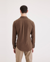 Back view of model wearing Thermax Caramel Café Men's Slim Fit Icon Button Up Shirt.