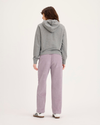 Back view of model wearing Toadstool Blake Chino Pants, High Straight.