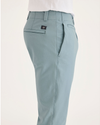 Side view of model wearing Tourmaline Alpha Chino Pants, Skinny Fit.