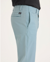 Side view of model wearing Tourmaline Alpha Chino Pants, Slim Fit.