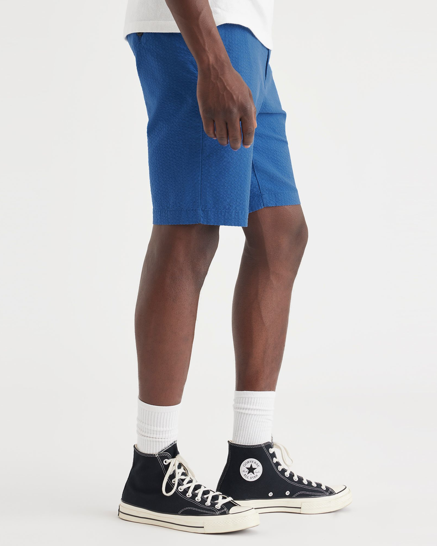 Side view of model wearing True Blue Men's Supreme Flex Modern Chino Short.